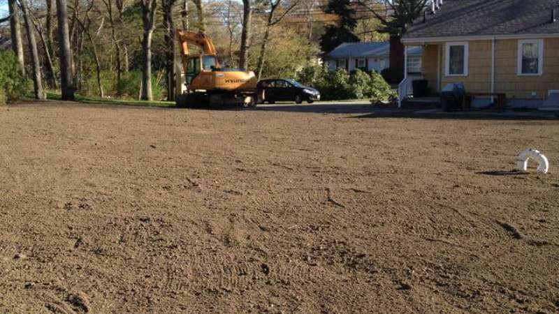 Yard fine graded with fresh loam, ready for hydroseed